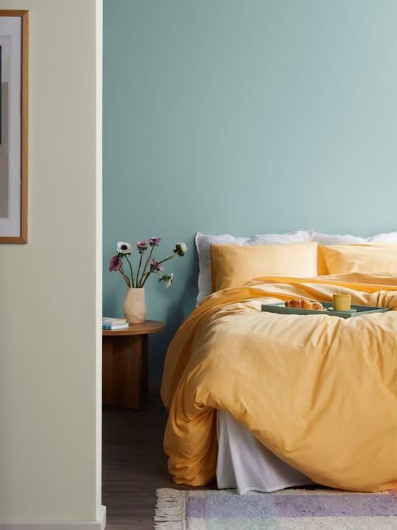 Green painted bedroom wall